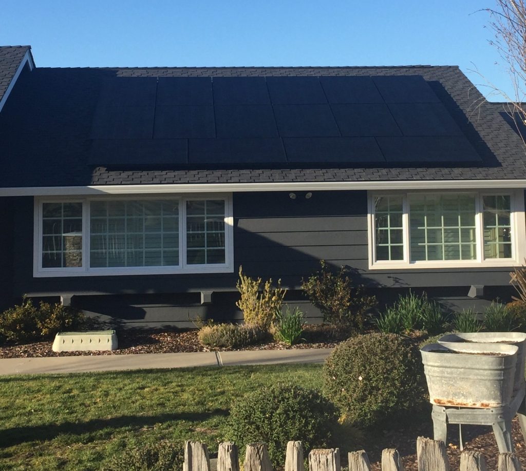Photo of home with solar panels on it