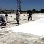 Commercial crew working on a new flat roof
