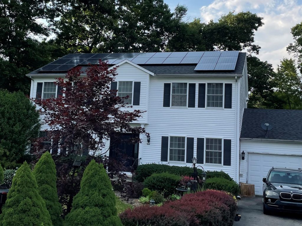 House with new Pawcatuck Roofing Solar Pannels