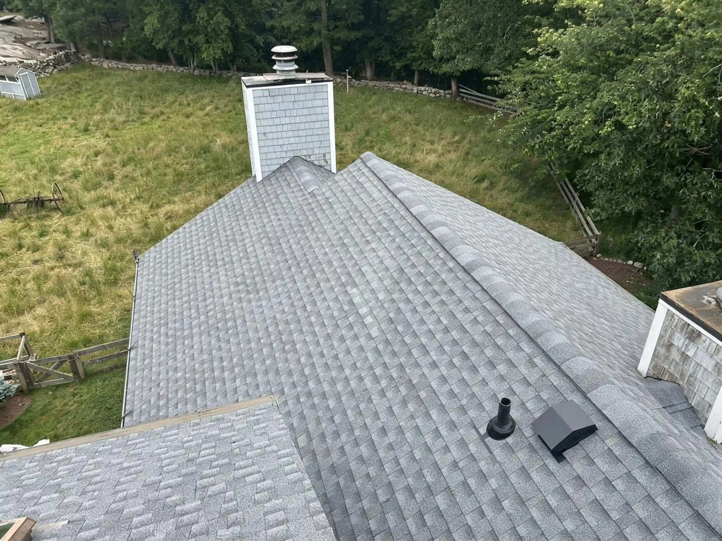 Residential roof replacement and roof vent installation in Stonington, CT by Pawcatuck Roofing Company.