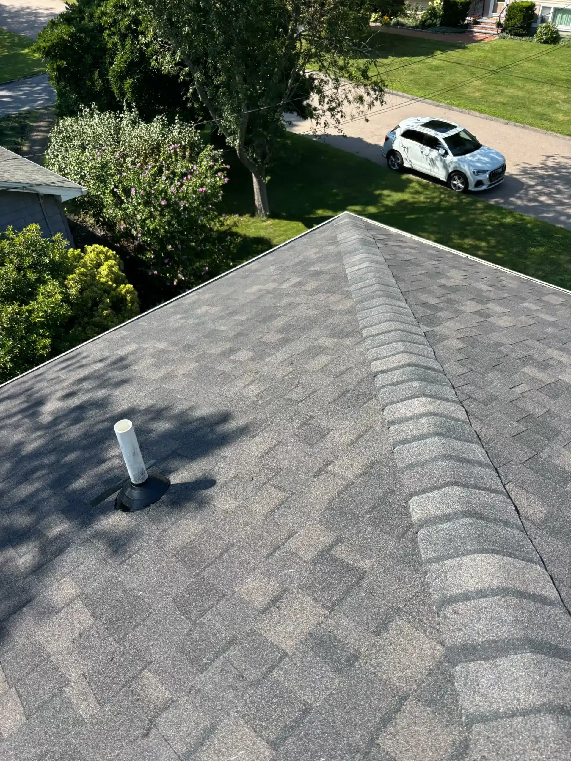 Mystic, CT home after a roof replacement and professional gutter guard installation